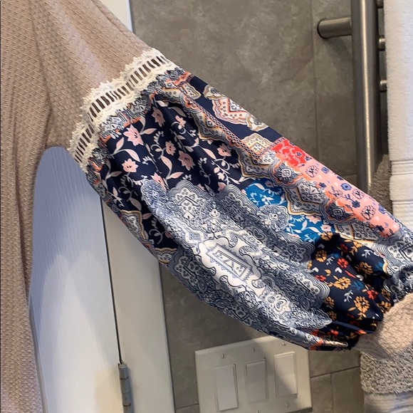 Tan shirt multi color sleeve. Good condition. - Picture 2 of 5